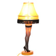 Load image into Gallery viewer, 26-inch deluxe tabletop leg lamp with thigh-high fishnet stocking, gold fringe shade, and wood base, illuminated
