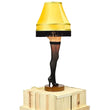 Load image into Gallery viewer, 26-inch deluxe tabletop leg lamp with thigh-high fishnet stocking, gold fringe shade, and wood base, illuminated
