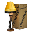 Load image into Gallery viewer, 26-inch deluxe tabletop leg lamp shown next to cardboard fragile shipping box
