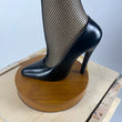 Load image into Gallery viewer, 50 inch full size leg lamp close up of the black high heeled shoe and wood base.
