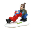 Load image into Gallery viewer, Department 56 A Christmas Story Village Ralphie Rescue figurine showing Ralphie in green coat and knit hat helping Randy in red snowsuit off the snow, with green schoolbook on white base
