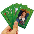 Load image into Gallery viewer, Hand holding fanned Elf movie playing cards from 10 through ace of clubs
