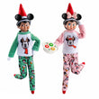 Load image into Gallery viewer, Two Scout Elves in Mickey and Minnie Mouse Cookies for Santa pajama sets with ear headbands and a cookie plate
