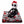 Load image into Gallery viewer, Jack Skellington plush doll wearing Santa hat, sitting on folded Nightmare Before Christmas throw blanket featuring festive spooky motifs.
