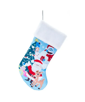 Christmas stocking featuring Rudolph, Santa Claus, Bumble the Abominable Snow Monster, and Hermey the elf with a Christmas tree and presents. White plush cuff.