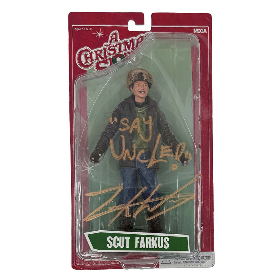 NECA Scut Farkus action figure from A Christmas Story, autographed by Zack Ward with "Say Uncle!" in gold marker