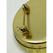 Load image into Gallery viewer, Back of the brass secret decoder pin with stamped stars and locking safety-clasp pin
