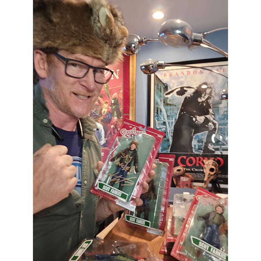 Close-up of autographed NECA Scut Farkus figure with original packaging, signed by Zack Ward with gold ink