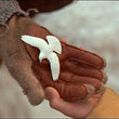 Load image into Gallery viewer, Turtle dove friendship ornament held in hand
